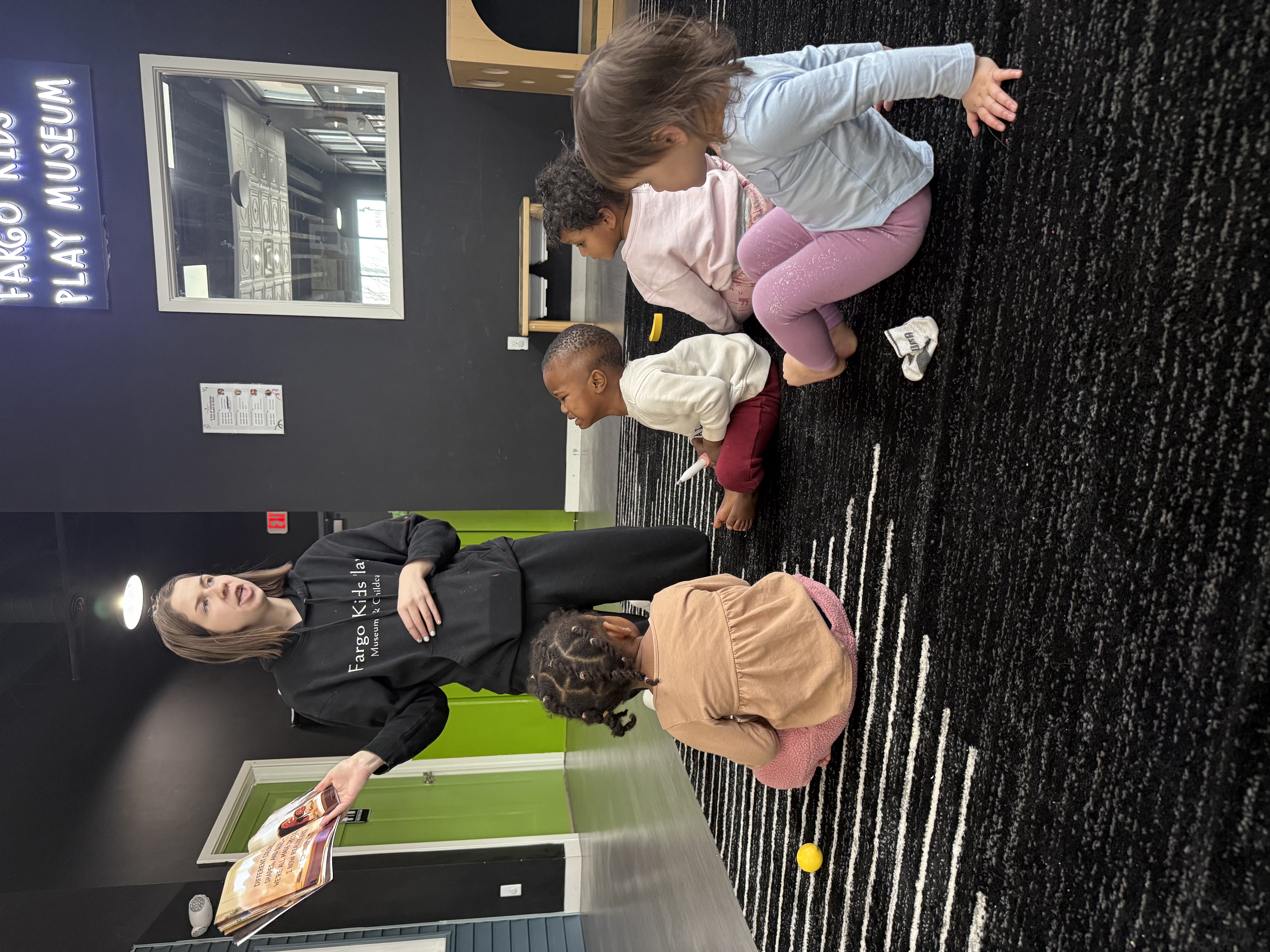 Teacher supporting children in a calm classroom